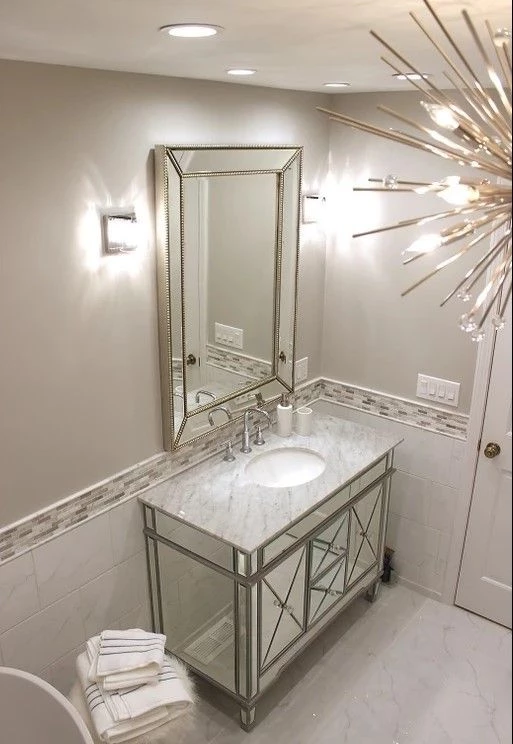 Luxury vanity area with granite counter and stylish oval sinks