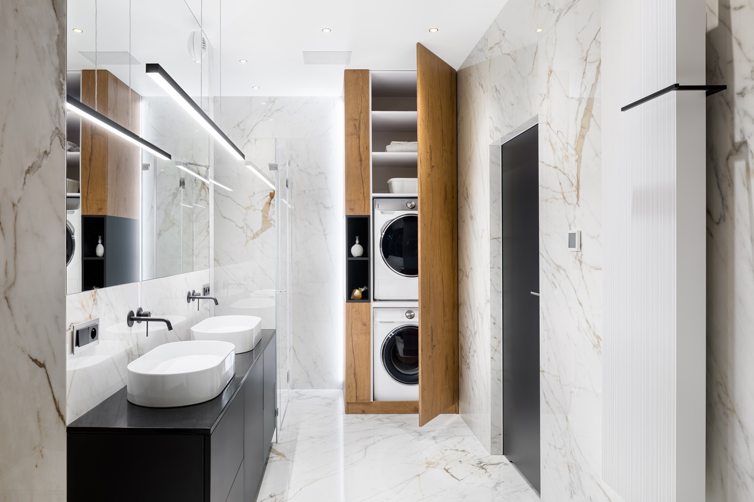 Renovated master bathroom with elegant storage cabinets