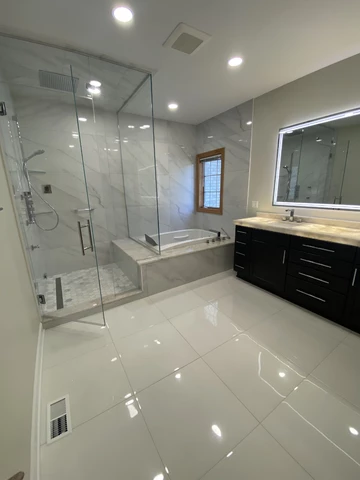 Bathroom renovation highlighting minimalist walk-in shower design