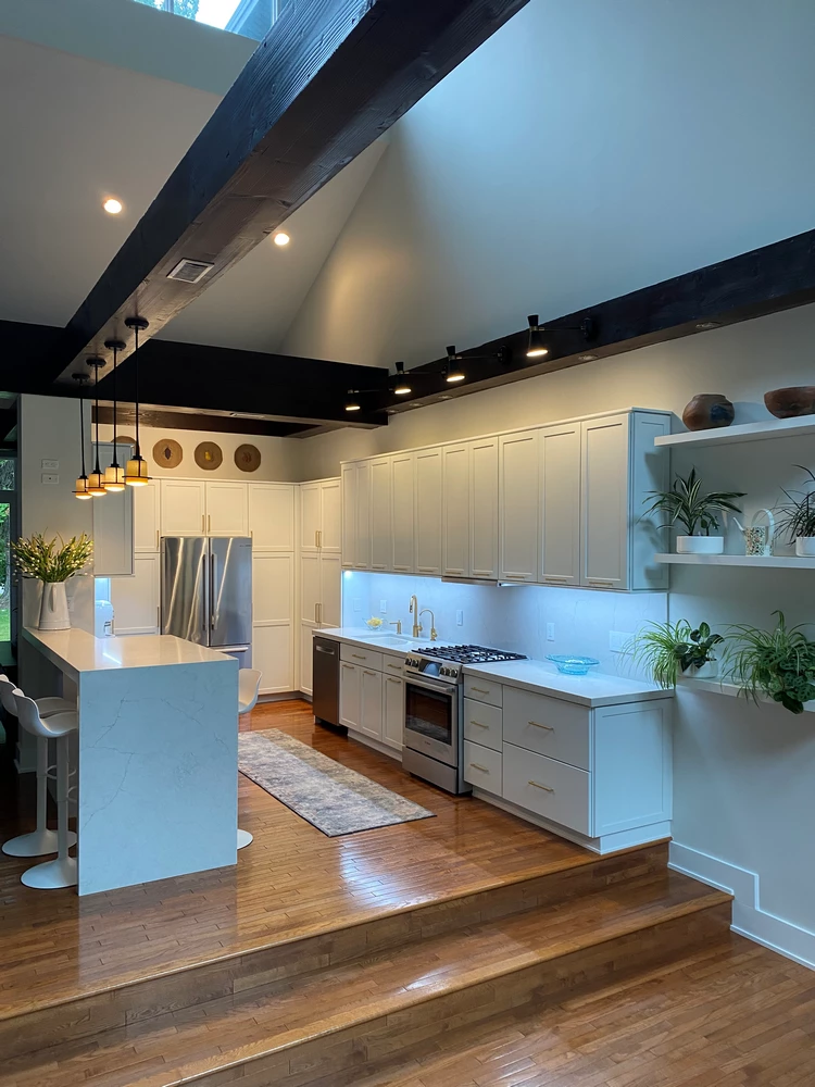 Bright kitchen remodel with white cabinets and quartz counters