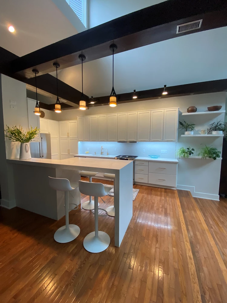 Full kitchen renovation featuring custom-designed storage cabinets