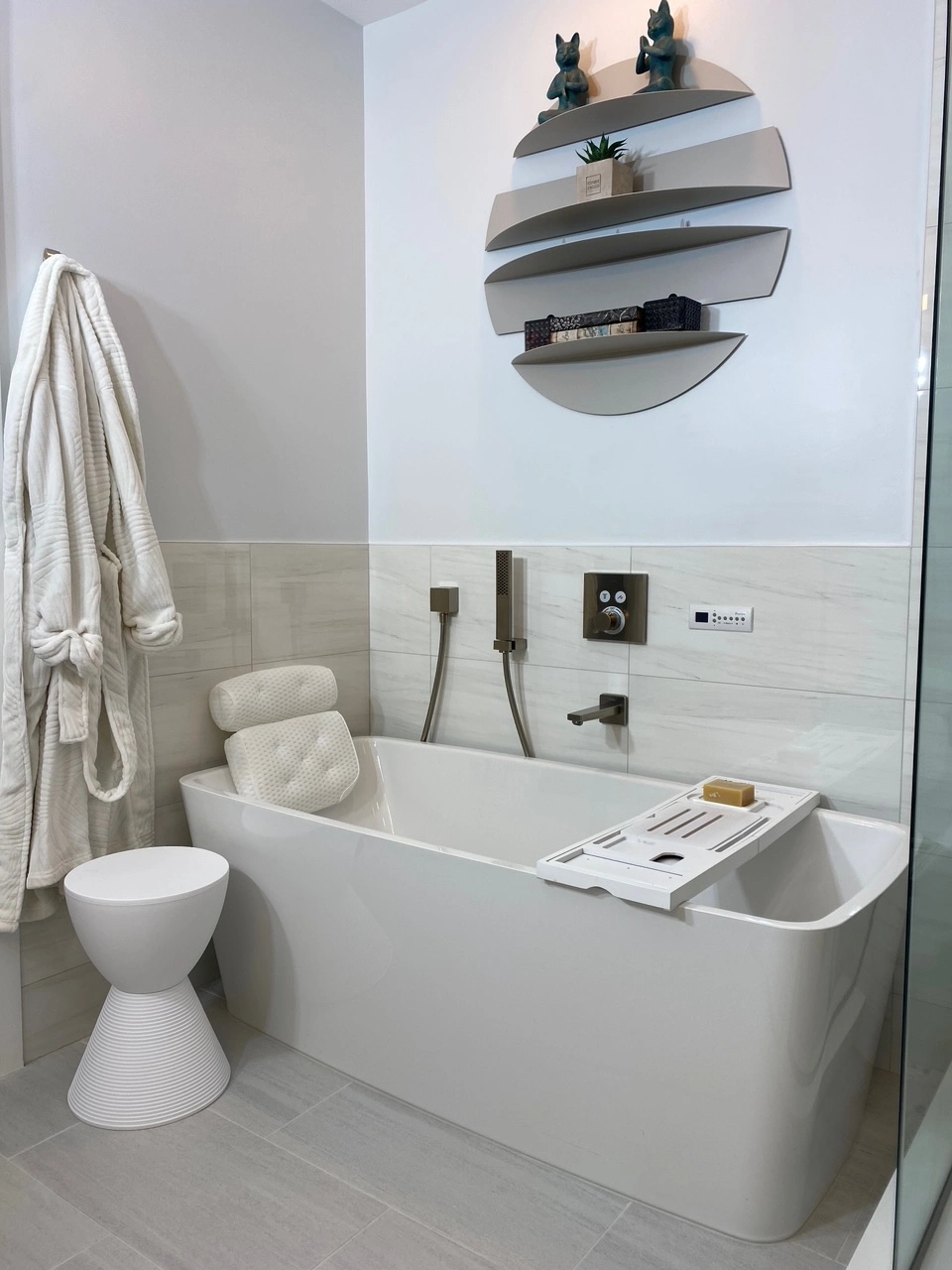 Traditional bathroom remodel with tiled walls and elegant fixtures
