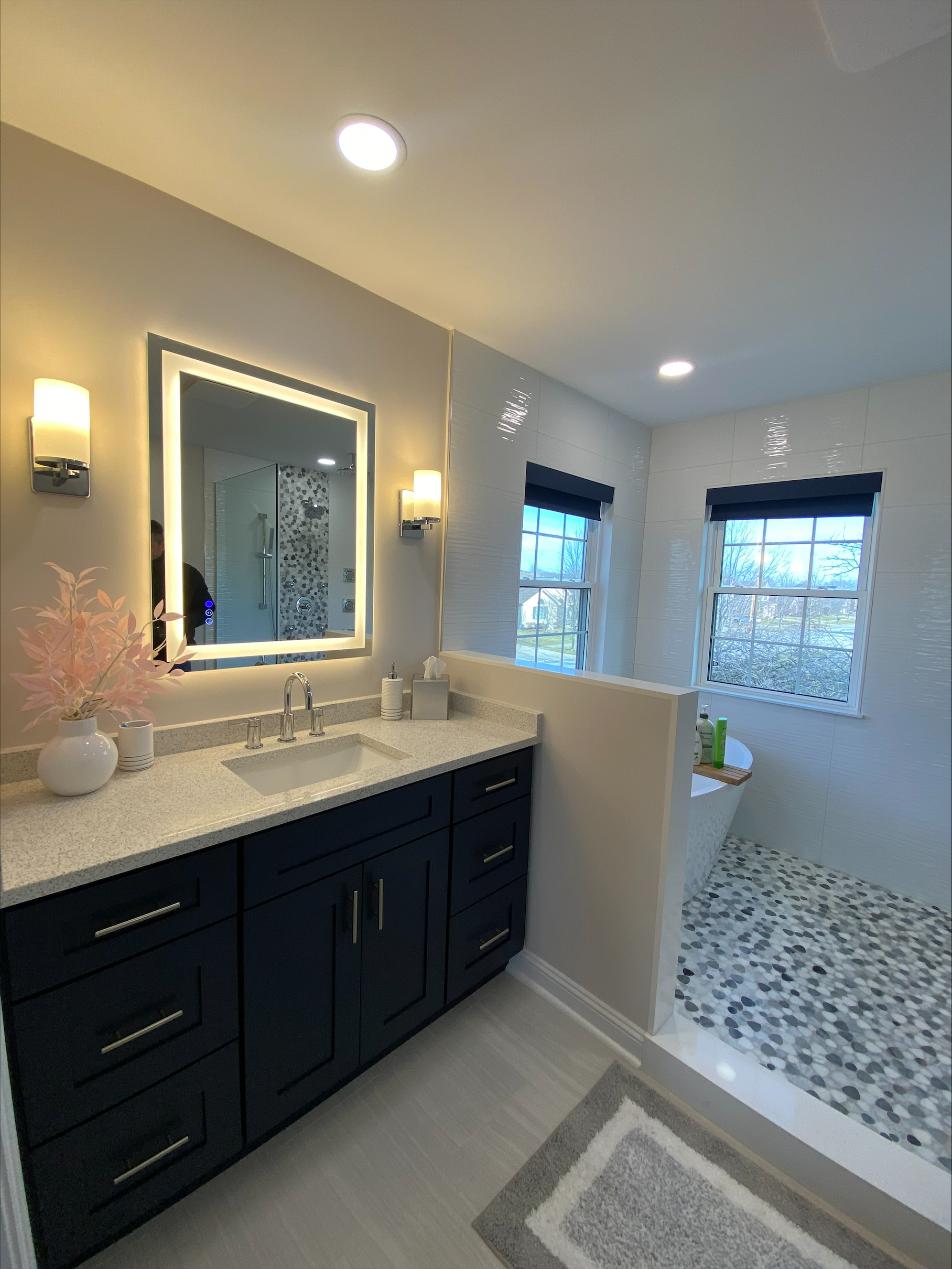 Traditional bathroom remodel with tiled walls and elegant fixtures