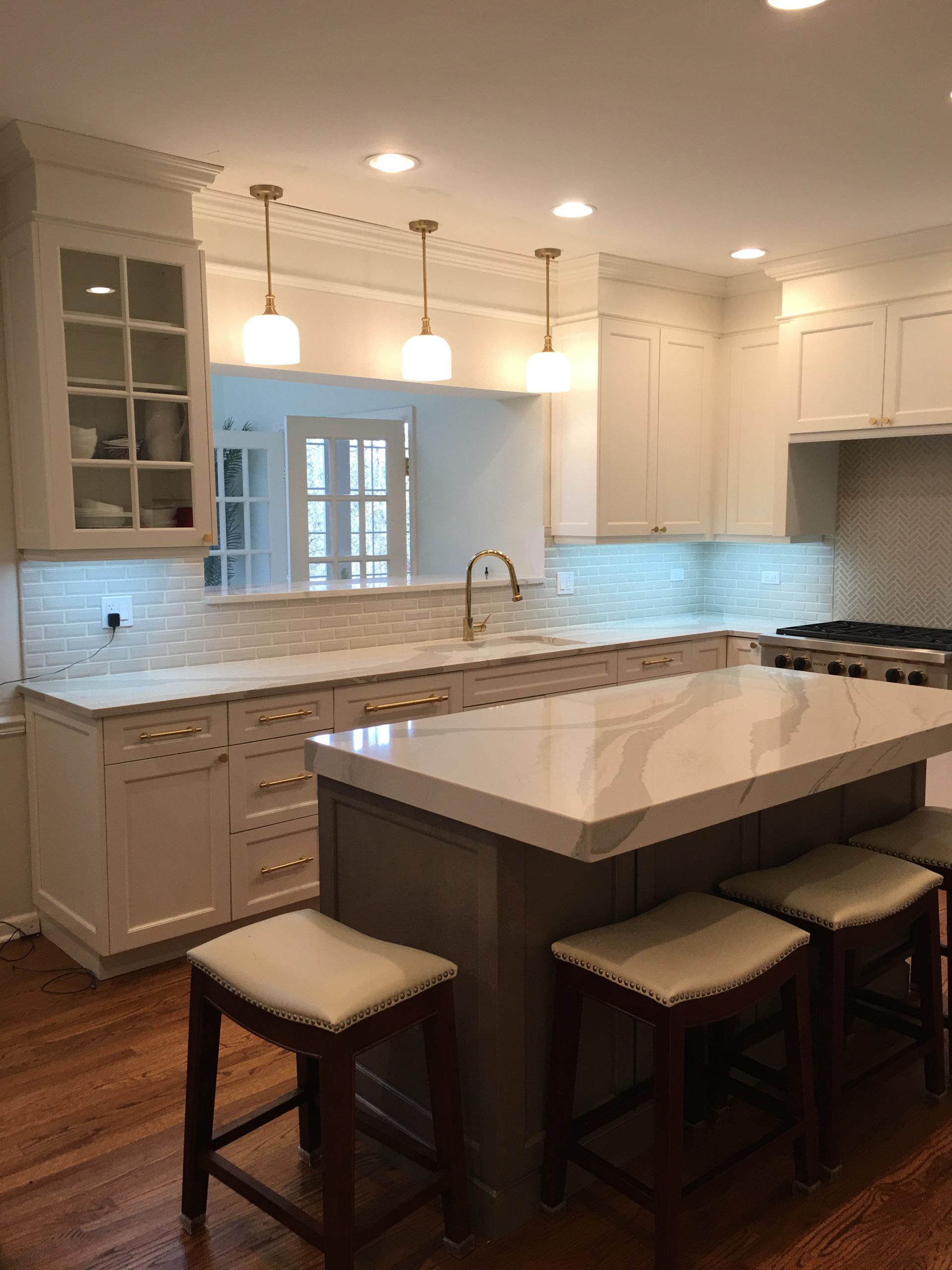 Modern kitchen renovation with custom white shaker cabinets